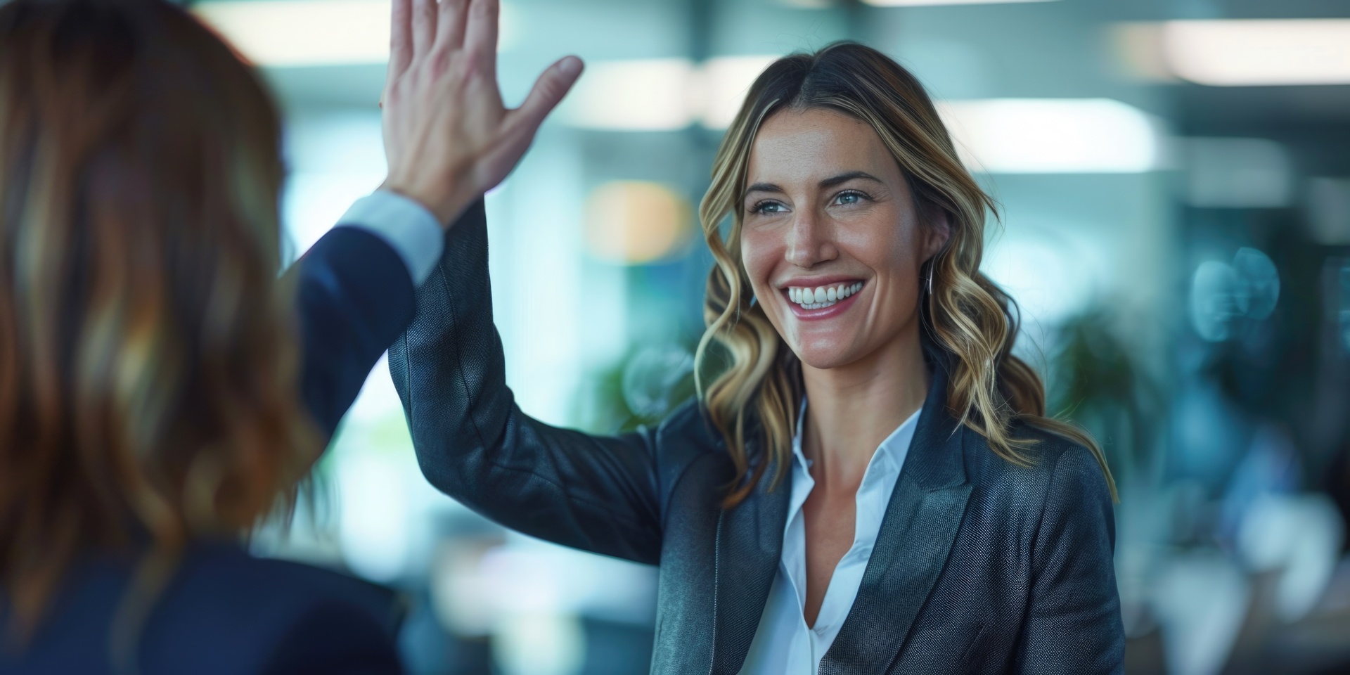New Zealand business professionals celebrating successful partnership and growth